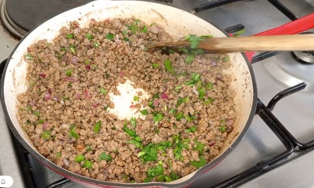Step 1.1: Stir in the coriander leaves, beef cubes and salt, mixing well