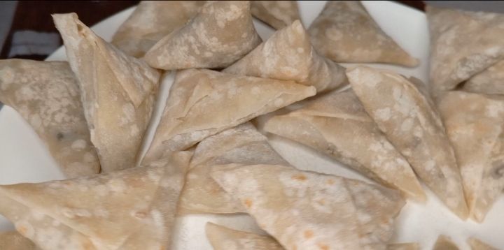 Step 2.3: Fold the wrap into a triangle, sealing the edges with a little water