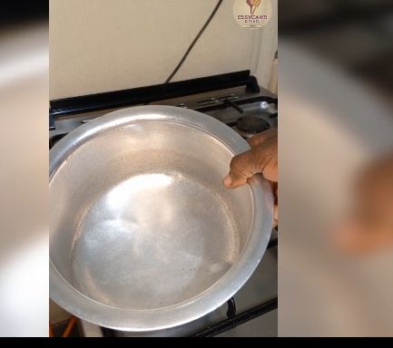 Step 2.8: In a large pot over medium heat, bring water to boil and add in soda ash, jute mallow and later in add spinach leaves cook until they begin to wilt