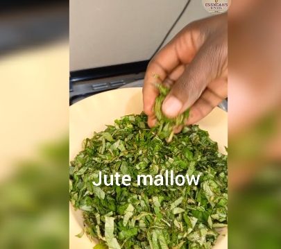 Step 2.6: In a large pot over medium heat, bring water to boil and add in soda ash, jute mallow and later in add spinach leaves cook until they begin to wilt