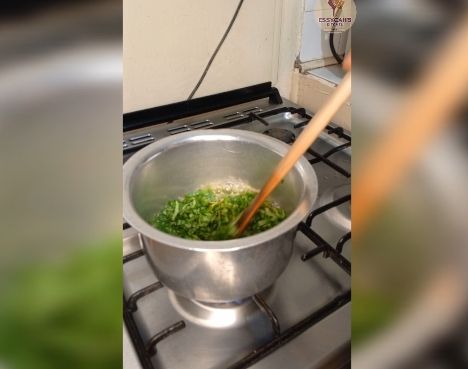 Step 2.3: In a large pot over medium heat, bring water to boil and add in soda ash, jute mallow and later in add spinach leaves cook until they begin to wilt