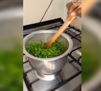 Step 2.1: In a large pot over medium heat, bring water to boil and add in soda ash, jute mallow and later in add spinach leaves cook until they begin to wilt