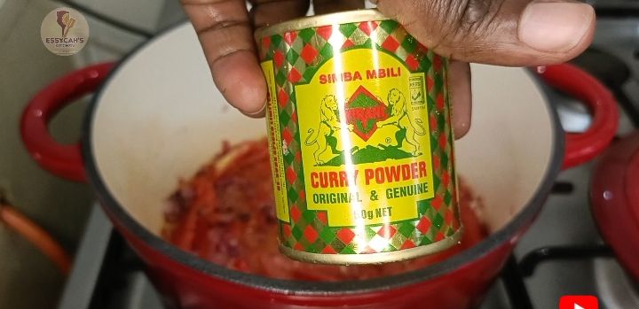 Step 3.4: Add the diced tomatoes, curry powder, royco beef cube and salt