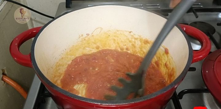 Step 3.3: Add the diced tomatoes, curry powder, royco beef cube and salt
