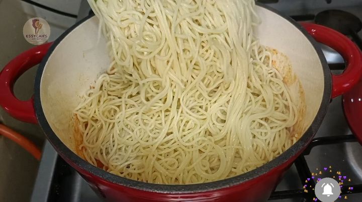 Step 4.2: Add the drained spaghetti to the skillet with the tomato sauce