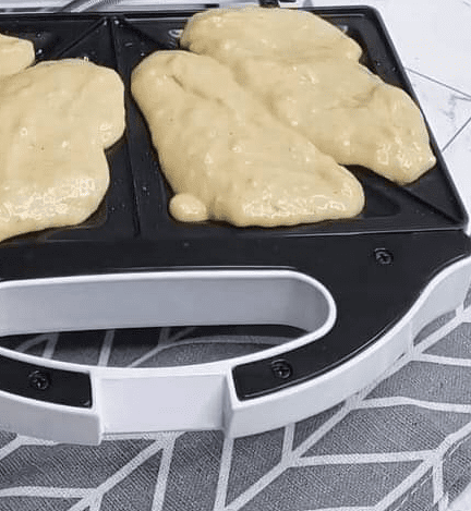 Step 1.1: Add half a spoonful of the mixture to each side of the bread toaster