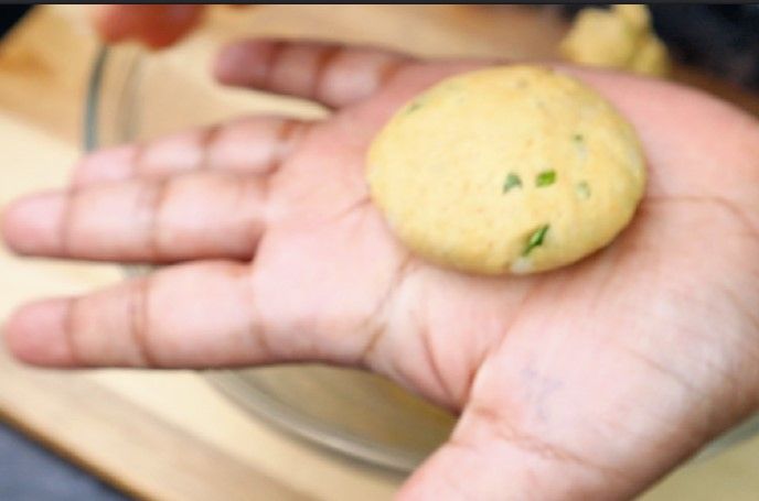 Step 3.1: Grease your hands and pinch the dough into small balls