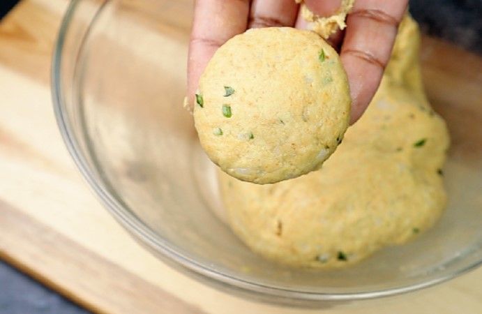 Step 3.2: Grease your hands and pinch the dough into small balls