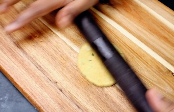 Step 3.1: Roll each ball into a poori using a rolling pin
