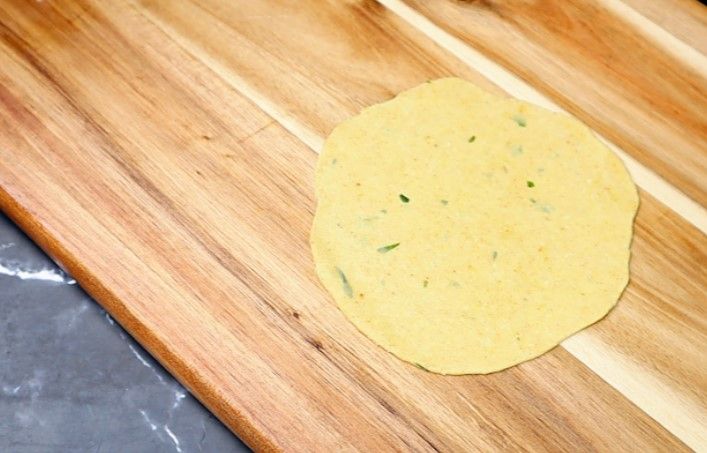 Step 3.2: Roll each ball into a poori using a rolling pin