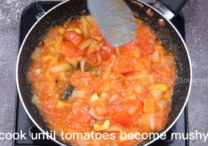 Step 2.4: Add chopped tomatoes, cashews, and salt
