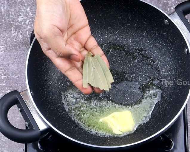 Step 4.2: In the same pan, add butter, bay leaf, turmeric powder, Kashmiri chilli powder, salt, and the prepared kadai masala powder