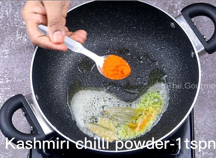 Step 4.4: In the same pan, add butter, bay leaf, turmeric powder, Kashmiri chilli powder, salt, and the prepared kadai masala powder
