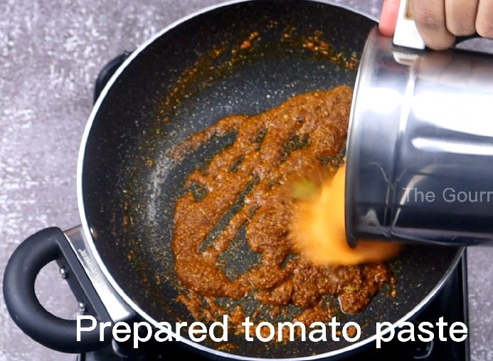 Step 4.1: Add the prepared tomato paste and saute until oil separates, about 15 minutes on low flame