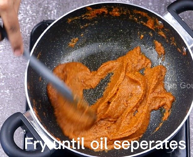 Step 4.3: Add the prepared tomato paste and saute until oil separates, about 15 minutes on low flame