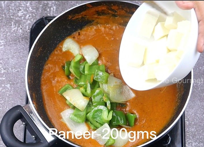 Step 4.2: Add the sauteed onion and capsicum petals, then add cubed paneer