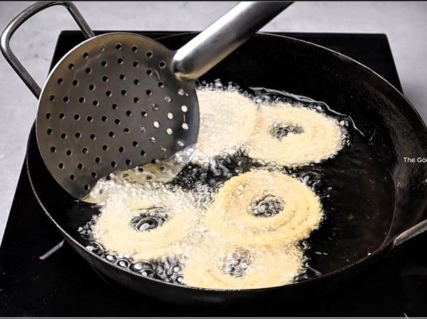 Step 2.1: Fry by flipping occasionally until they turn golden brown