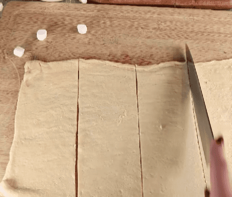 Step 1.1: Roll out the crescent dough and cut it into 8 squares
