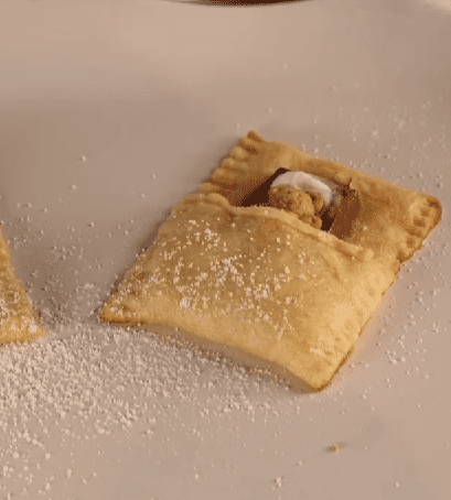 Step 1.1: Fold up the bottom of the pastry, tucking in the Teddy Grahams