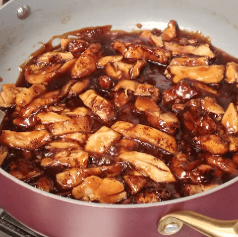 Step 4.1: Toss the chicken back into the pan, coat with the sauce, and simmer for 1 more minute
