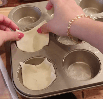 Step 1.1: Press puff pastry squares into a muffin tin
