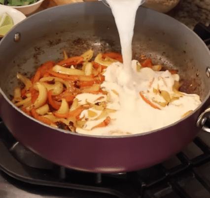 Step 1.1: Pour in the coconut milk and bring the mixture to a simmer