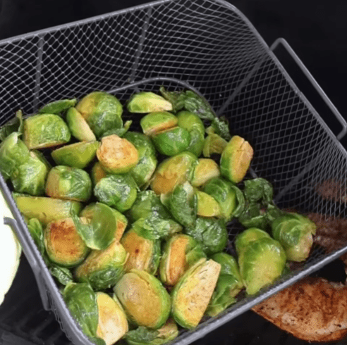 Step 1.2: Grill chicken and halved Brussels sprouts on medium-high heat until golden and charred