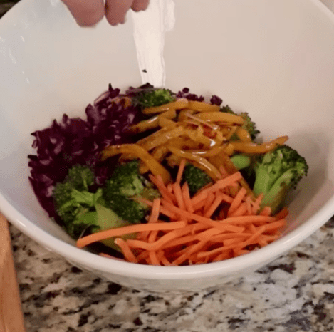 Step 1.1: Layer the quinoa, veggies, and chicken in a bowl and top with sesame seeds