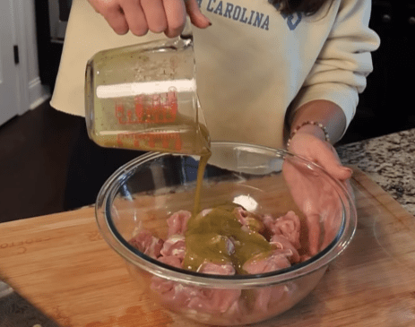 Step 1.1: Add the cubed chicken to the marinade and toss to coat