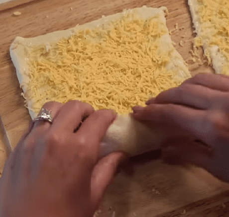 Step 1.1: Roll the puff pastry tightly into a log and slice into approximately 1-inch bites