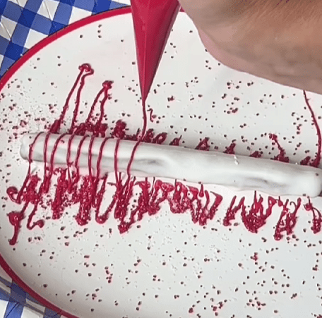 Step 1.1: Sprinkle the coated pretzels with patriotic sprinkles and drizzle additional melted candy for decoration