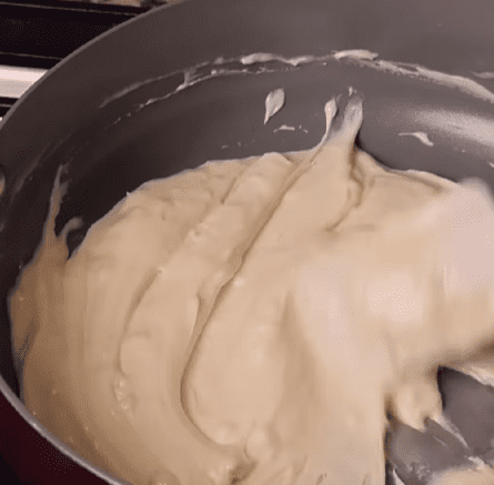 Step 1.1: Chill the chocolate layer while you melt the white chocolate chips, the remaining half of the condensed milk, and 2 tbsp of marshmallow crème