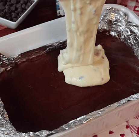Step 1.1: Spread the white chocolate layer on top of the chilled chocolate layer