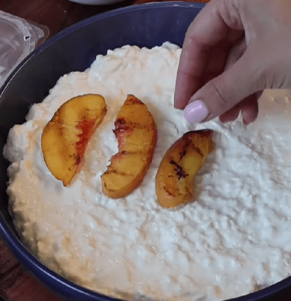 Step 1.1: Layer stracciatella on a plate, pile on the grilled peaches, nestle in torn prosciutto, and top with fresh basil and balsamic glaze