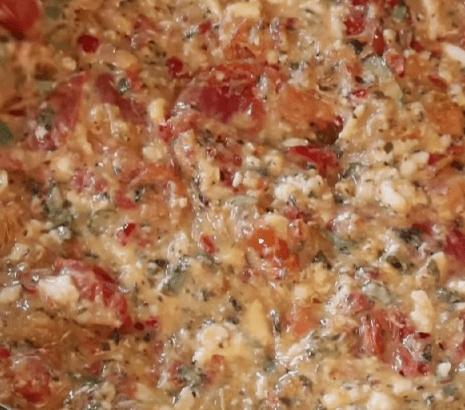 Step 5.2: Stir the stracciatella cheese into the roasted tomato mixture until creamy