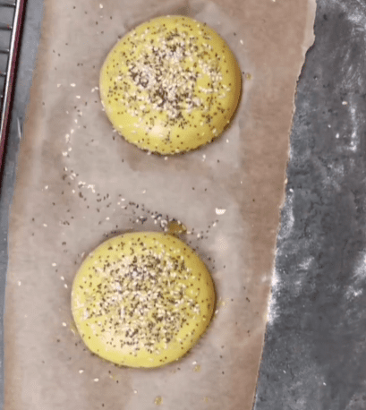Step 1.1: Brush the buns with a bit of plant milk and sprinkle some seeds on top