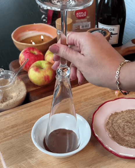 Step 1.1: Prepare the rim of the flute by dipping it in caramel sauce and then into a mixture of cinnamon sugar and sea salt