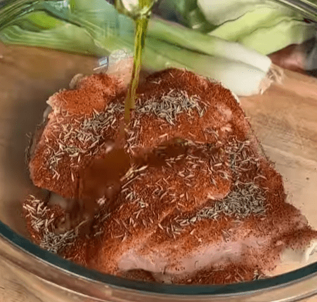 Step 1.1: Season chicken with Cajun spice, salt, pepper, and olive oil