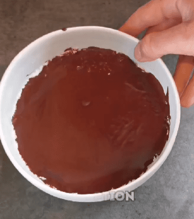 Step 1.1: Pour the melted chocolate on top of the mixture