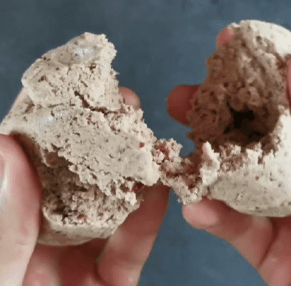 Step 1.2: Process the dates, protein powder, and maple syrup in a food processor until you get a sticky ball