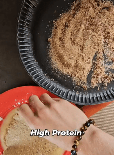 Step 1.1: Take each schnitzel, roll it into the panade mix, then into the breadcrumbs to cover them fully