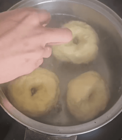 Step 1.1: Remove the bagels from the water and place them on a baking sheet