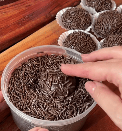Step 1.1: Roll the mixture into balls and coat them in chocolate sprinkles