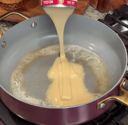 Step 1.1: Add Eagle Brand sweetened condensed milk and unsweetened cocoa to the saucepan