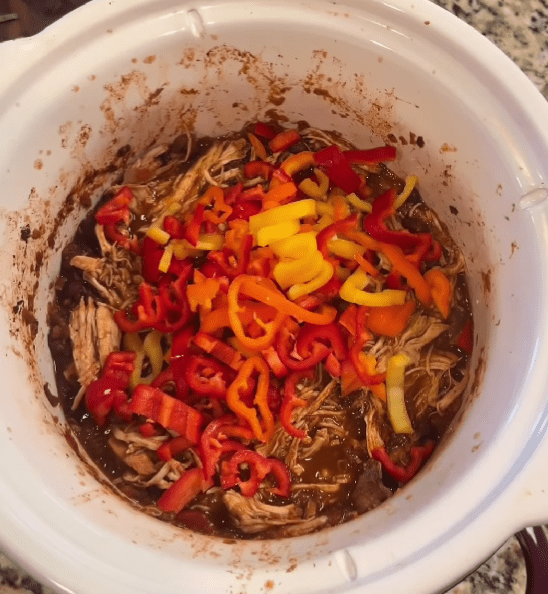 Step 1.1: Add sliced mini peppers, corn, and chopped green onions in the last 30 minutes of cooking