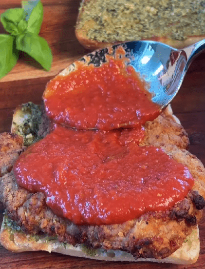 Step 1.1: Spoon marinara sauce over the chicken, then top with mozzarella