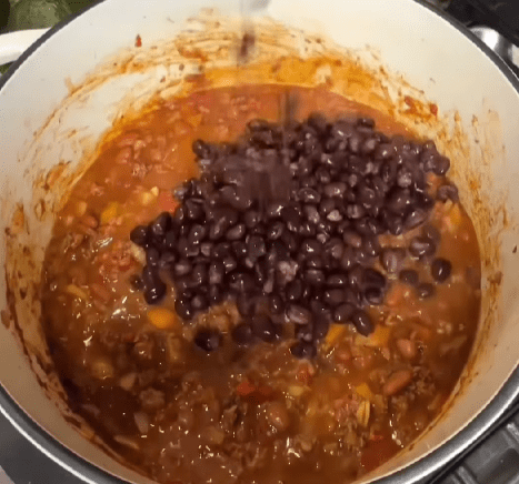 Step 1.1: Add Rotel Diced Tomatoes with Green Chilies, Bush’s Mild Pinto Chili Beans, diced tomatoes, and black beans