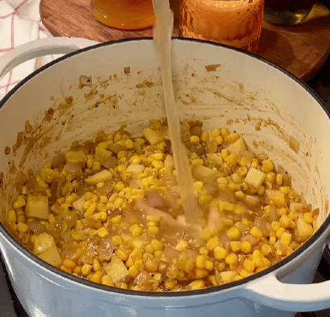 Step 1.1: Add the corn, creamed corn, potatoes, and white parts of the green onion