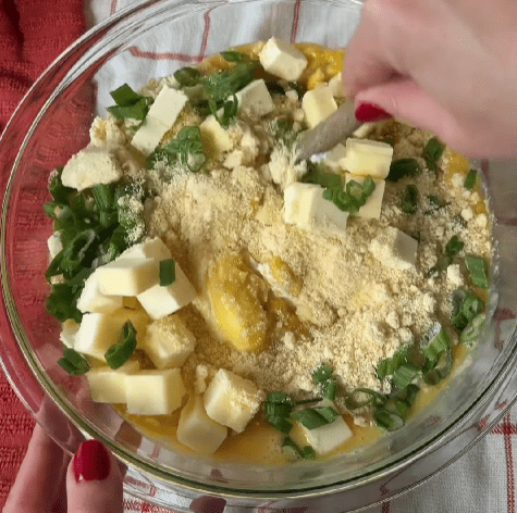 Step 1.1: In a large bowl, whisk together the eggs, butter, sour cream, creamed corn, whole kernel corn, and honey