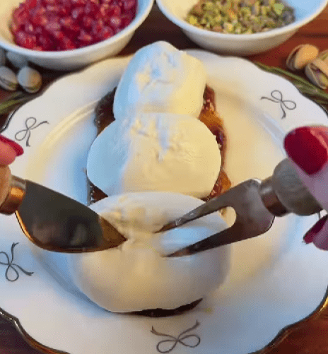 Step 1.1: Place the burrata on top and gently tear it open